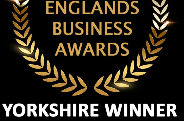 England's Business Awards Yorkshire Winner logo with gold laurel wreath on black background