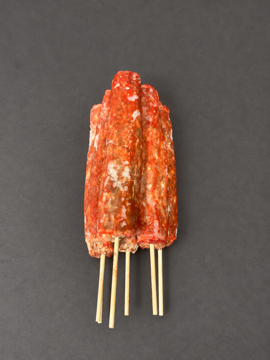Lamb Kofta on a smooth charcoal background