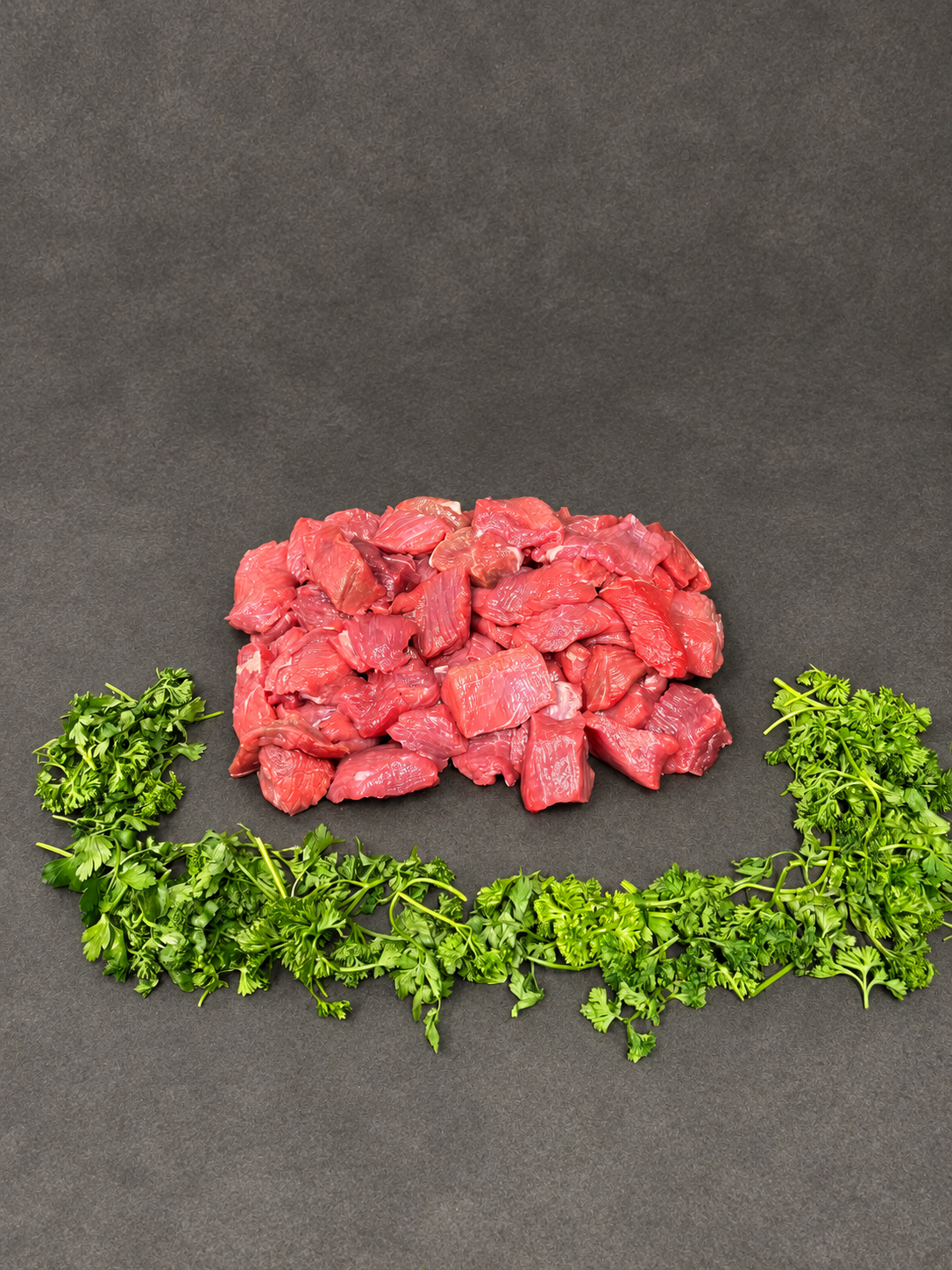 Diced Beef on a smooth charcoal background