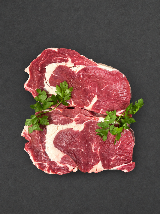 Ribeye Steak on a smooth charcoal background