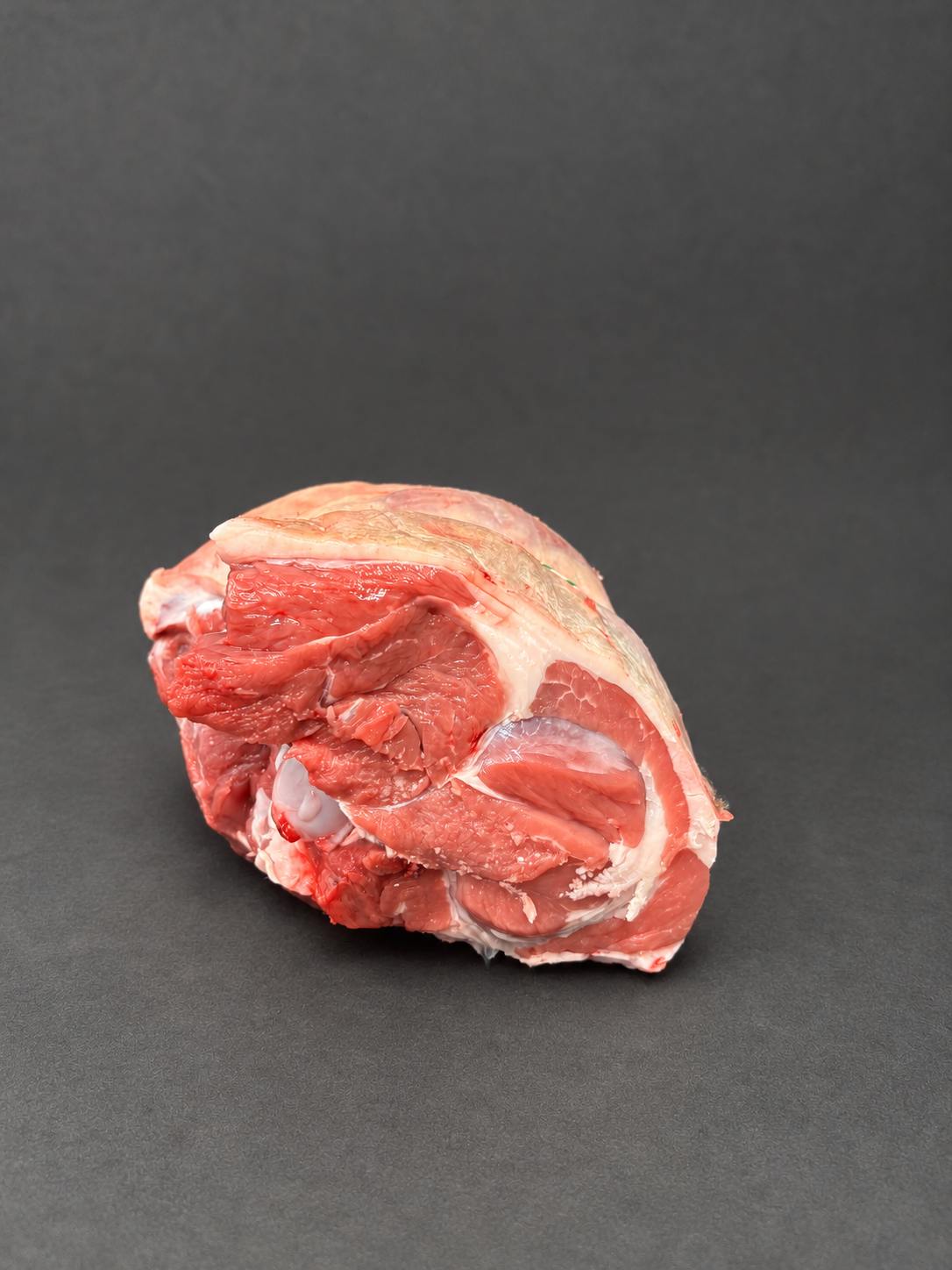 Leg Of Lamb on a smooth charcoal background