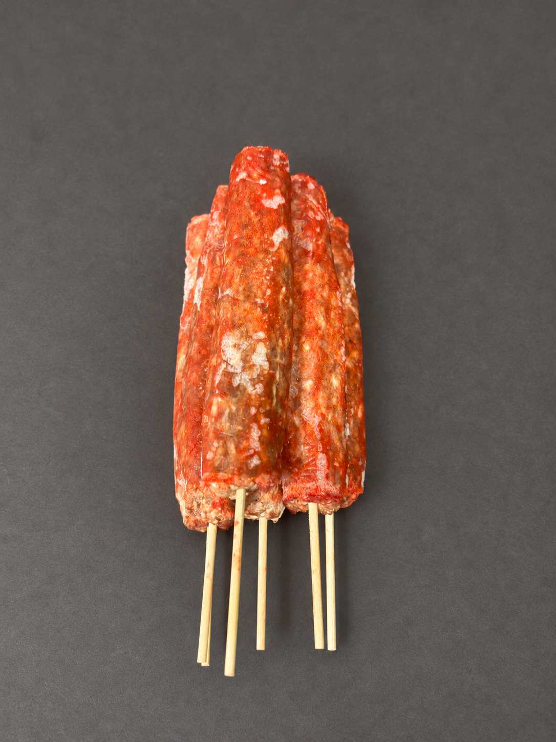 Lamb Kofta on a smooth charcoal background