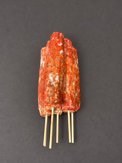 Lamb Kofta on a smooth charcoal background