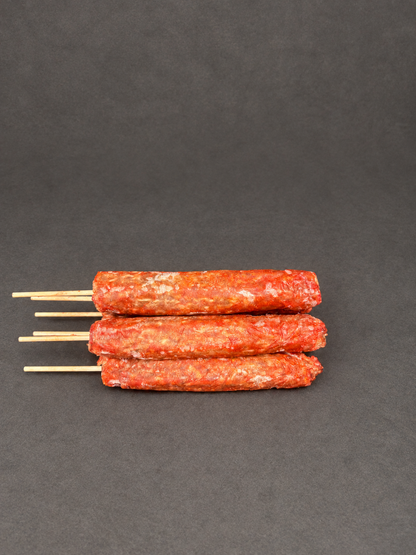 Lamb Kofta on a smooth charcoal background