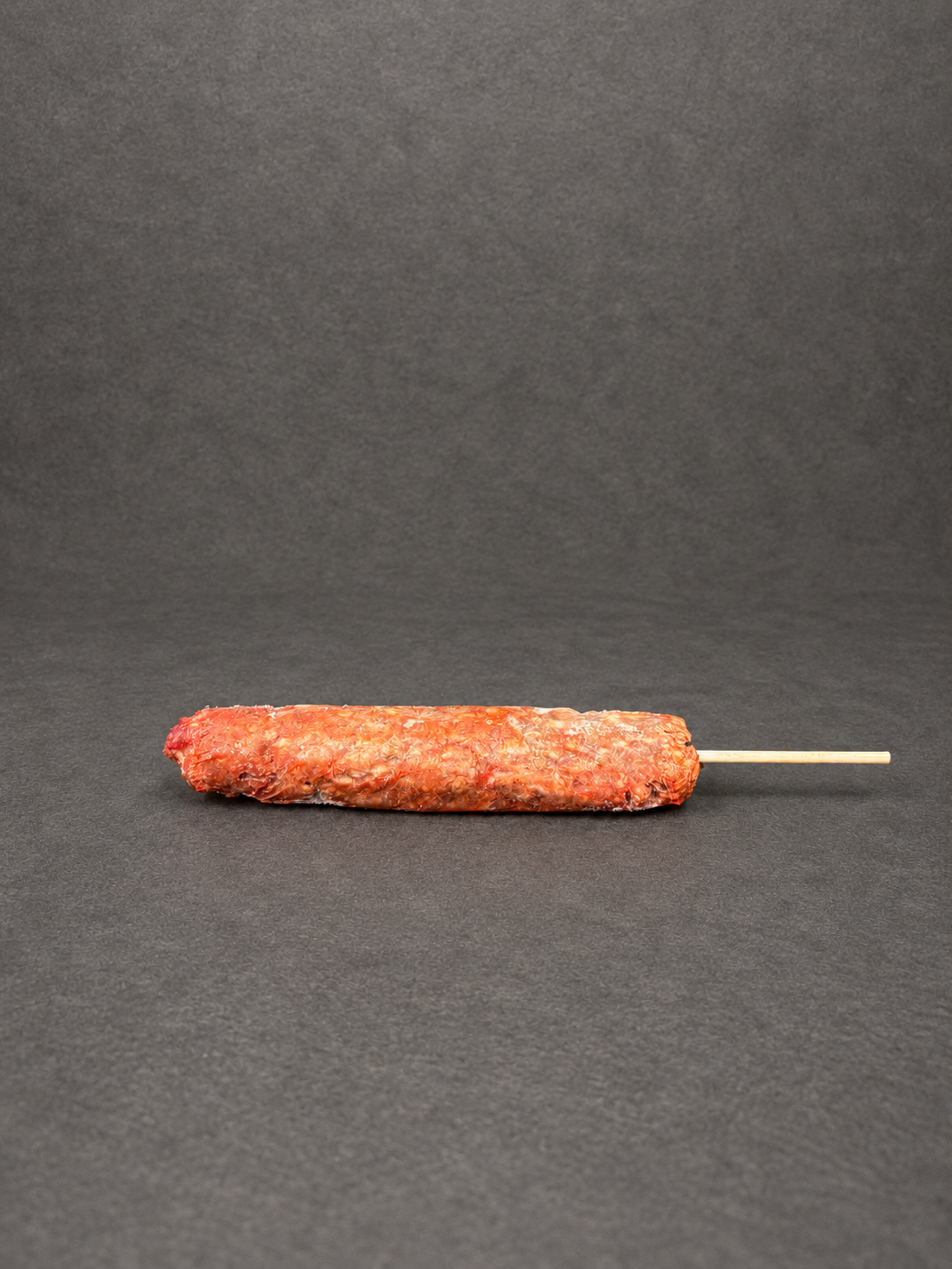 Lamb Kofta on a smooth charcoal background