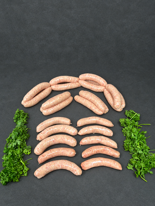 Thin Pork Sausage on a smooth charcoal background