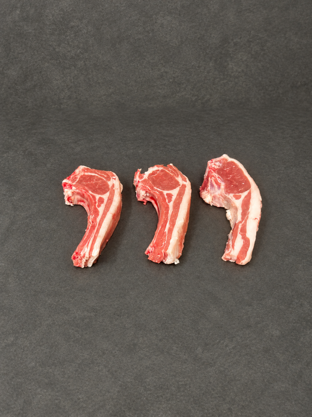 Lamb Chop on a smooth charcoal background