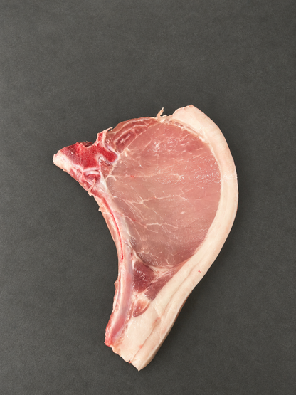 Pork Chops on a smooth charcoal background