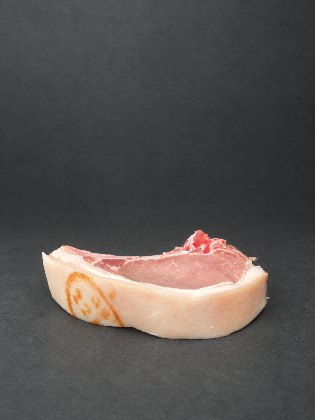 Pork Chops on a smooth charcoal background