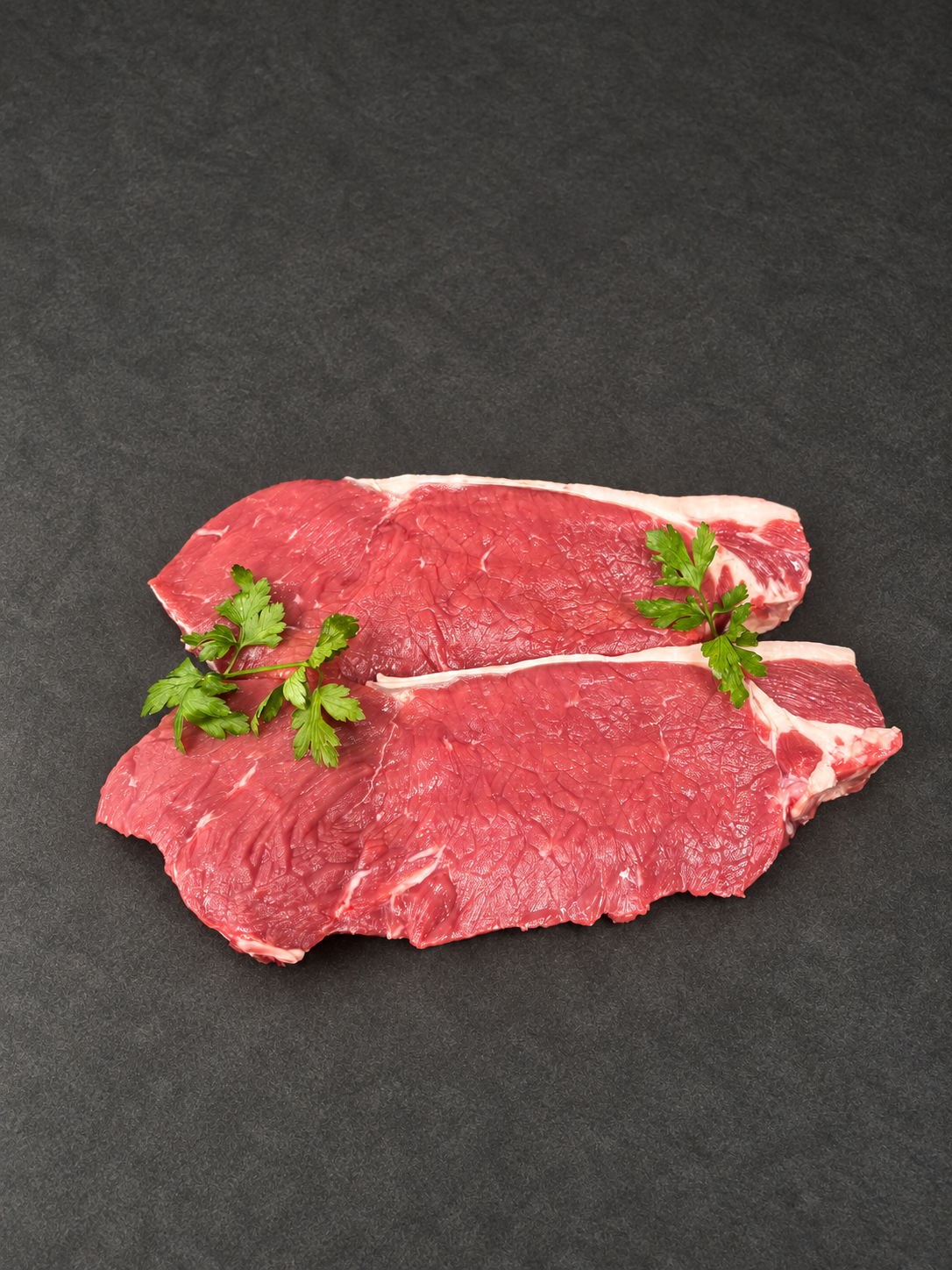 Sirloin Steak on a smooth charcoal background