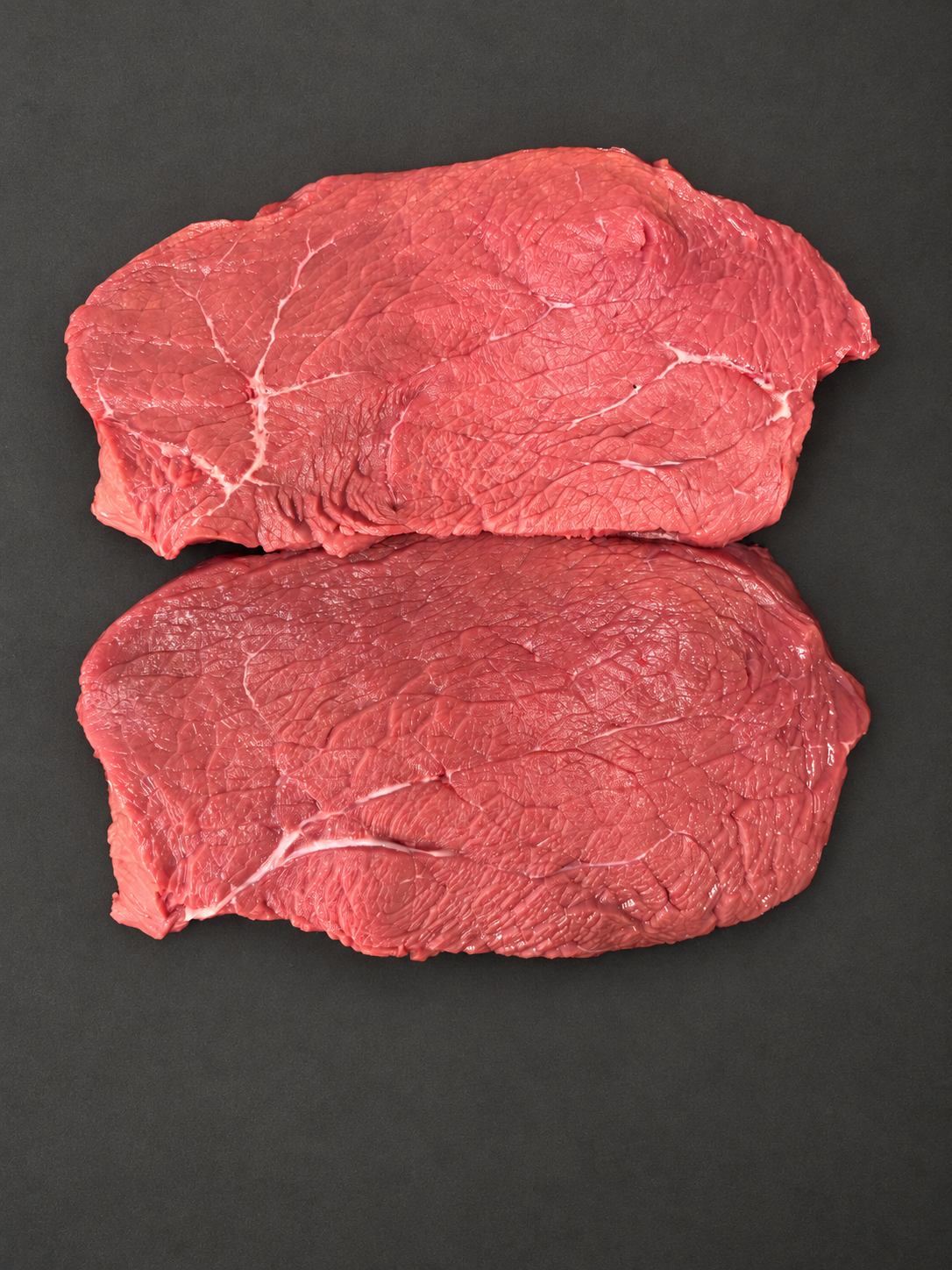 Rump Steak on a smooth charcoal background