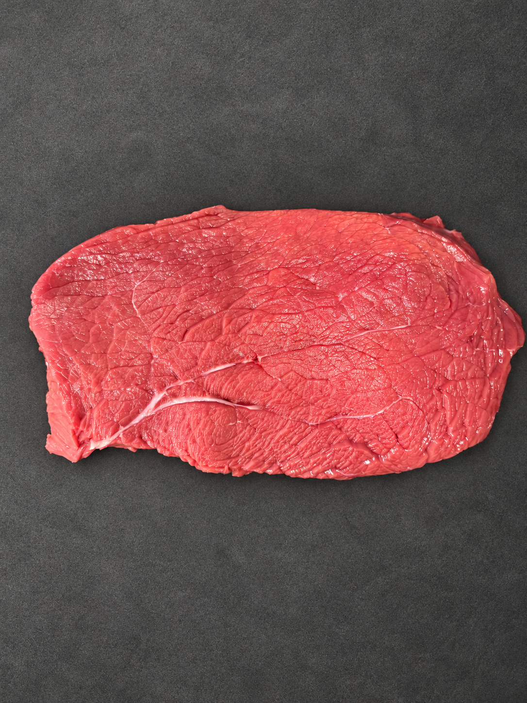 Rump Steak on a smooth charcoal background