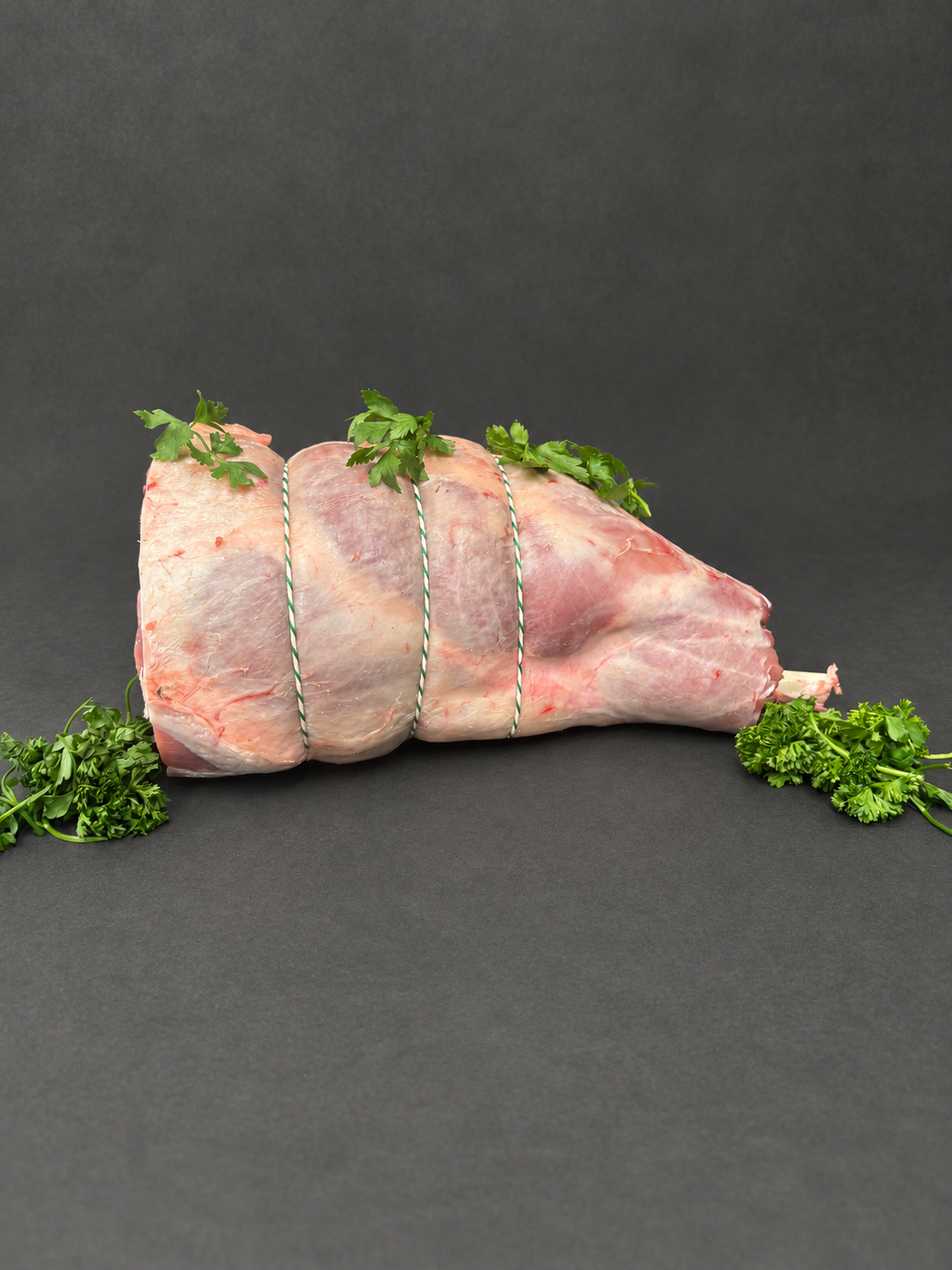 Leg Of Lamb on a smooth charcoal background