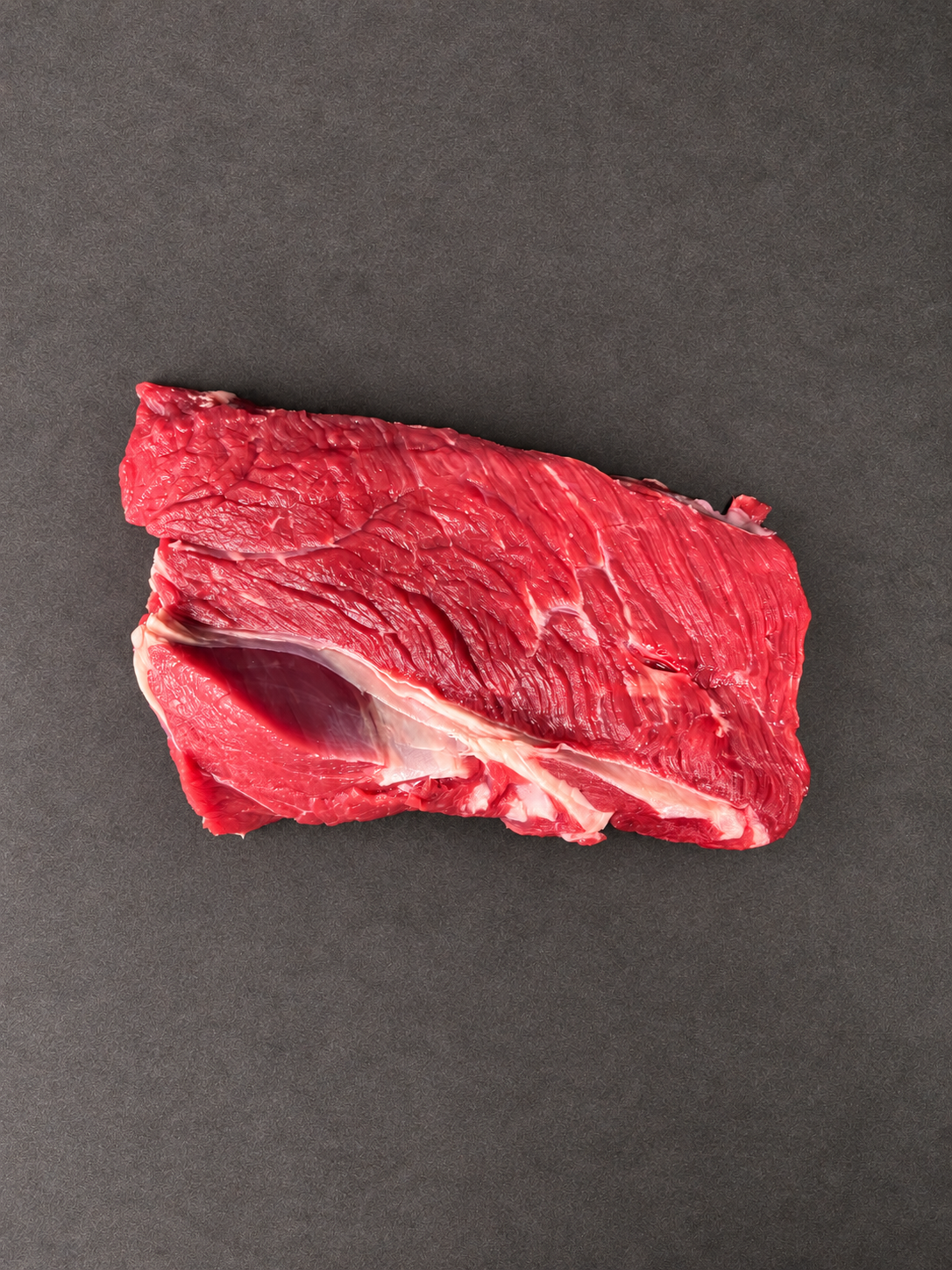 Shoulder Braising Steak on a smooth charcoal background