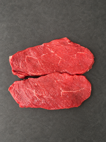 Lean Braising Steak on a smooth charcoal background