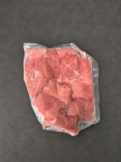 Diced Pork on a smooth charcoal background