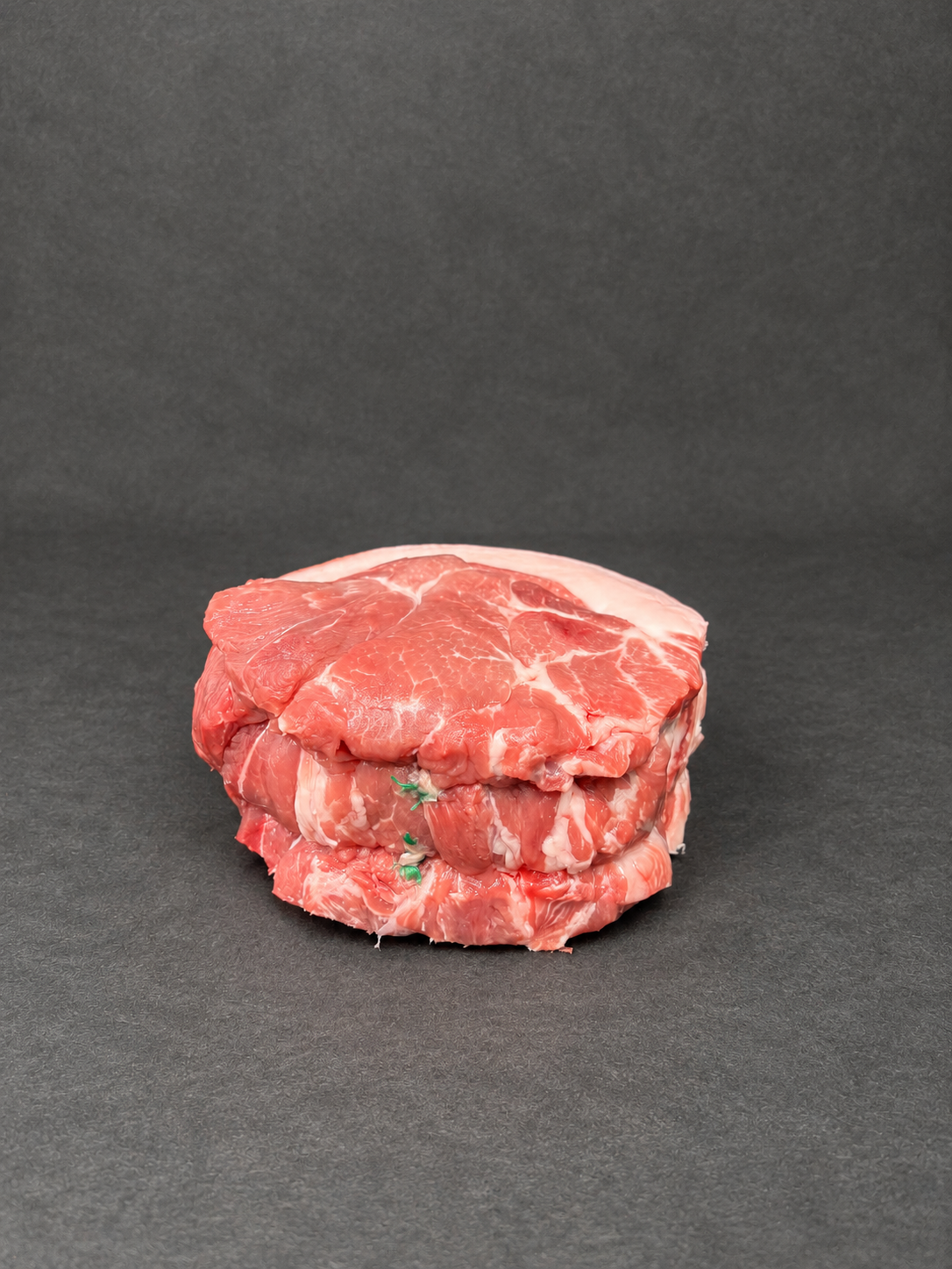 Shoulder Of Pork on a smooth charcoal background