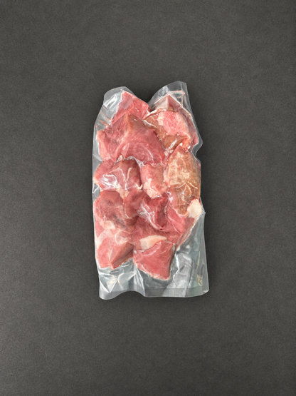 Diced Lamb on a smooth charcoal background